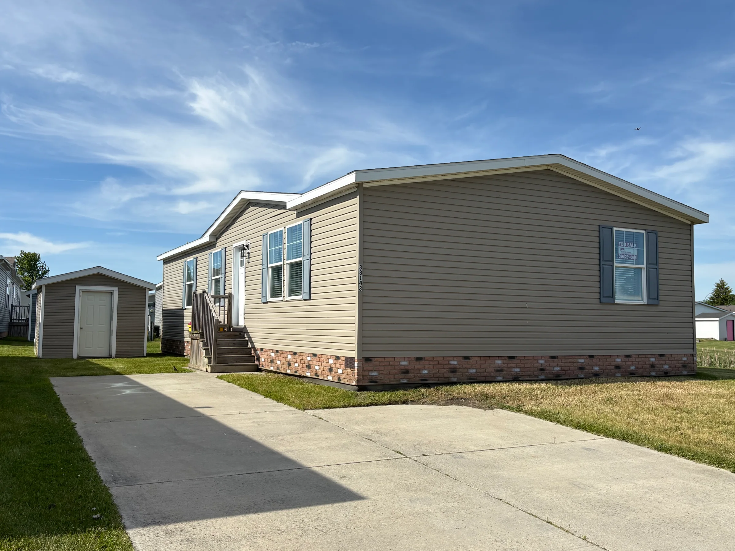 33143 Aspen Court manufactured home in Meadow Creek, New Haven, MI — photo 1