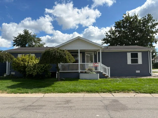 15303 Enchante Drive manufactured home in River's Edge, Clinton Twp, MI — photo 1